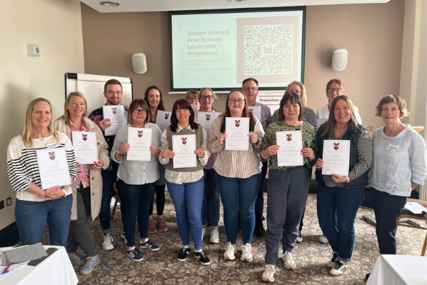 Participants proudly displaying their certificates for completing the programme.